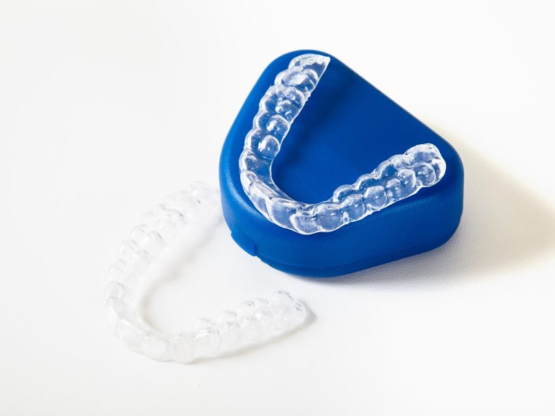 two dental whitening trays and a box for it